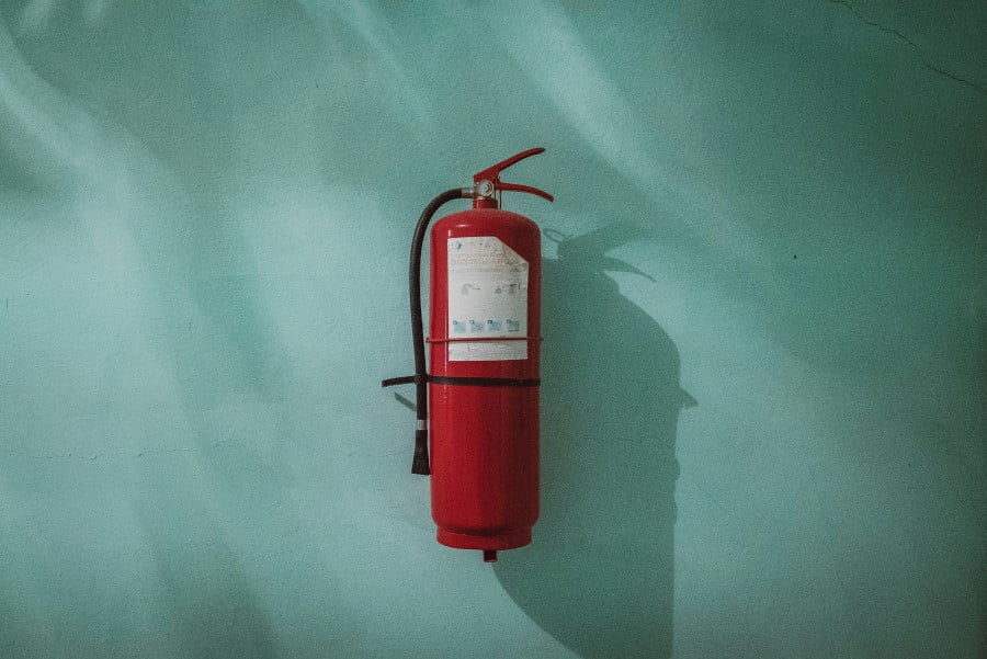 a fire extinguisher on a wall