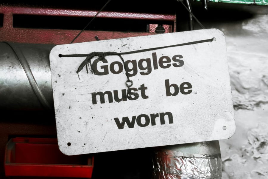 Goggles a sign from a wall