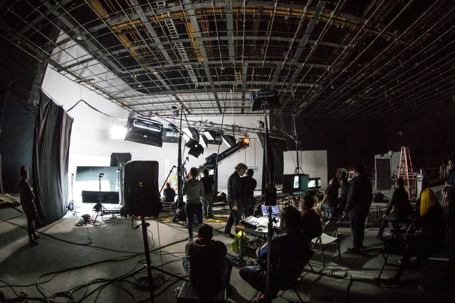 Temp Locations a group of people in a room with equipment and lights